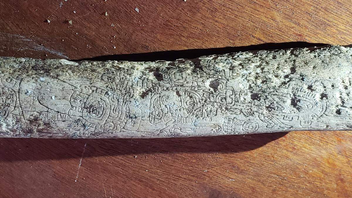 Engraved femur bones were also found within the tomb.