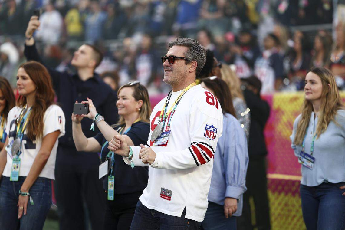 SANTA CLARA, CALIFORNIA - FEBRUARY 8: Jon Hamm watches from the sidelines as Bad Bunny performs in the Apple Music Halftime Show during the NFL Super Bowl 60 football game between the Seattle Seahawks and the New England Patriots, at Levi's Stadium on February 8, 2026 in Santa Clara, California. (Photo by Kevin Sabitus/Getty Images)