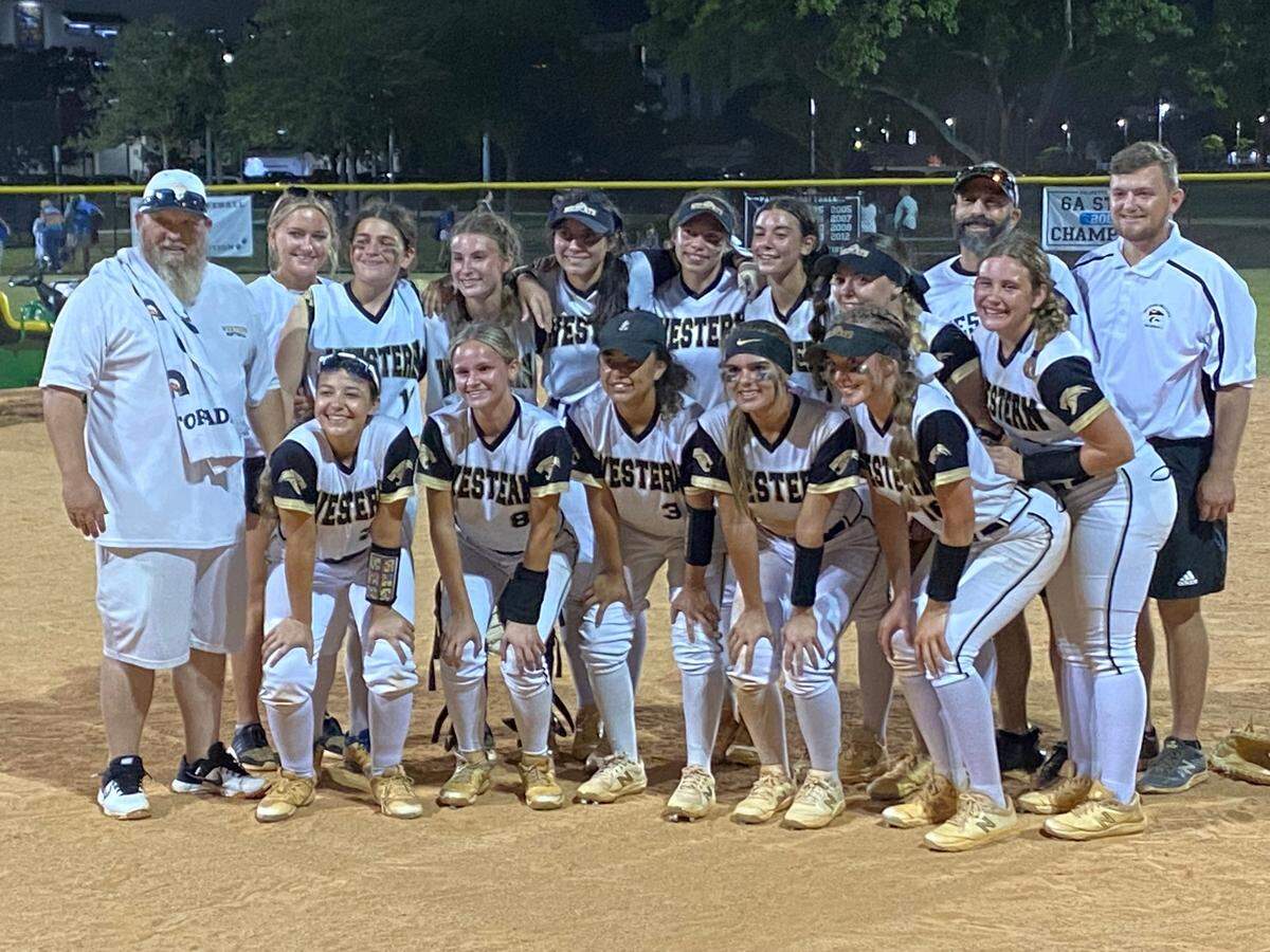 Western players celebrate after defeating Miami Palmetto 3-0 on Thursday night in the Region 4-7A softball final at Palmetto Bay Park. The Wildcats clinched their first berth in the state final four since 2018 when they won the school’s lone state title.