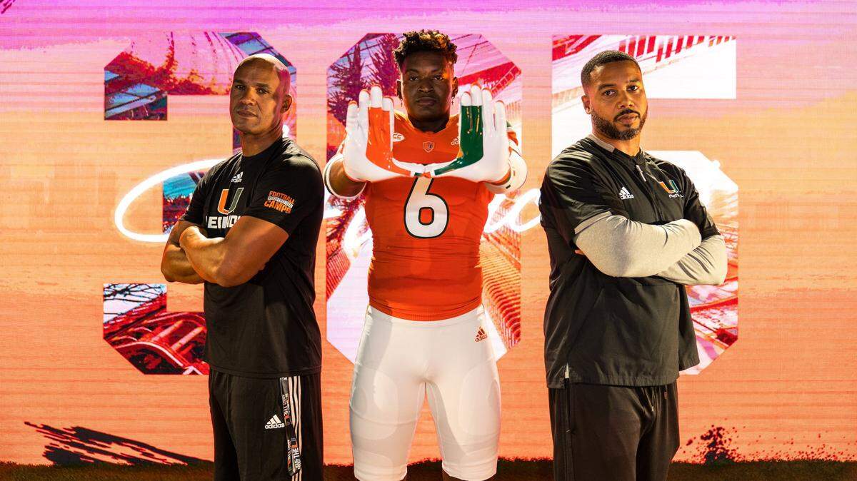 Defensive analyst Jason Taylor (from left), four-star athlete Collins Acheampong and defensive ends coach Rod Wright pose for a photo during Acheampong’s official visit with the Miami Hurricanes in June of 2022.