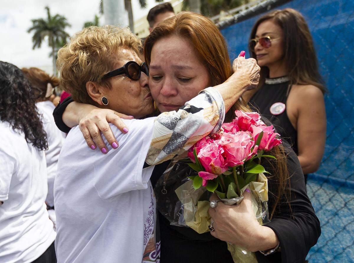 Gina Duran, the mother of Alexa Duran, who died last year in the FIU bridge collapse, embraces her mother, Gloria Ruiz, near the site of the tragedy on Friday, March 15, 2019. Family members honored the teen by gathering at her place of death.