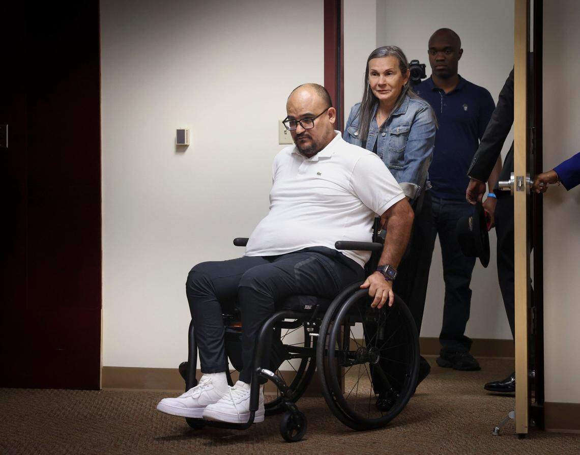 Michael Ortiz enters the room while being pushed in a wheelchair by his mother, Betty Garcia, before a press conference discussing his case on Wednesday, March 1, 2023, at the Broward Law Office of the Public Defender in Fort Lauderdale.