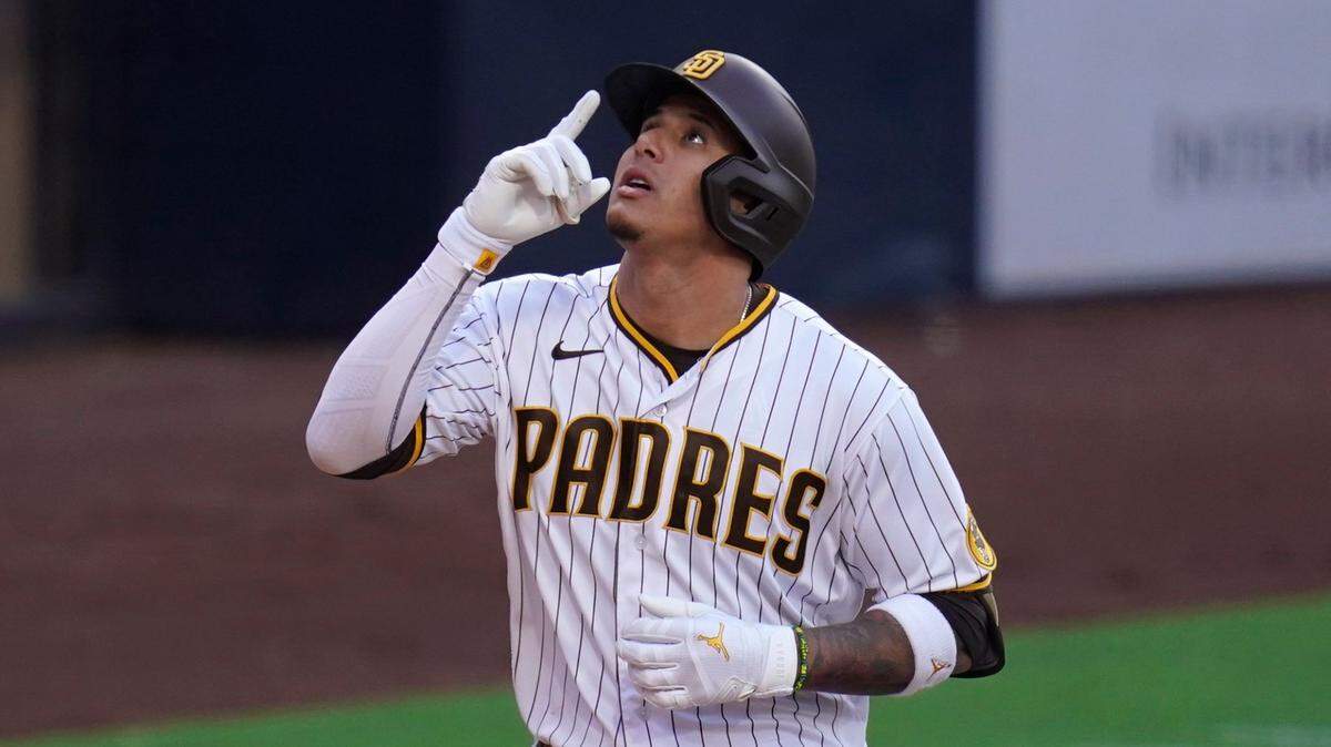 San Diego Padres’ Manny Machado reacts after hitting a home run during the first inning of a baseball game against the Miami Marlins, Thursday, May 5, 2022, in San Diego. (AP Photo/Gregory Bull)