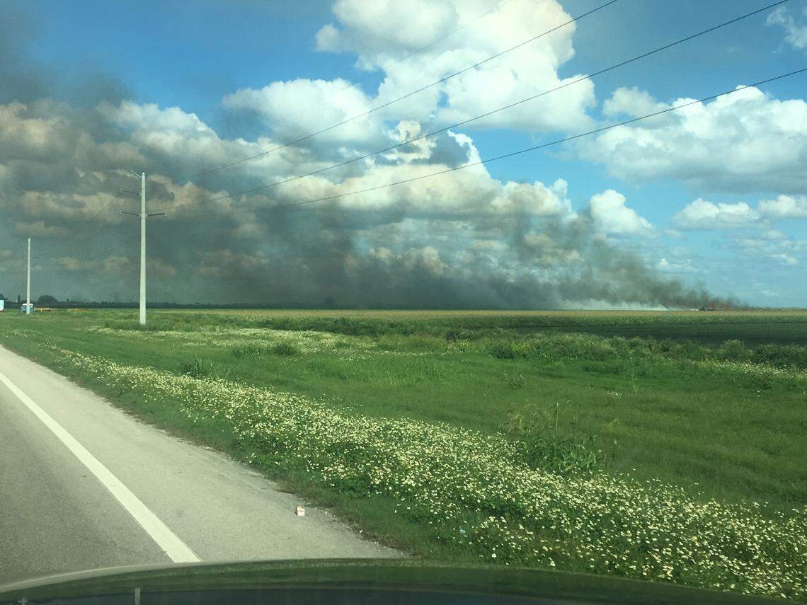 Smoke billows from burning cane fields — an annual practice that Florida sugar growers have employed for decades. Some residents in rural communities around Lake Okeechobee have sued to stop the burns, citing health concerns.