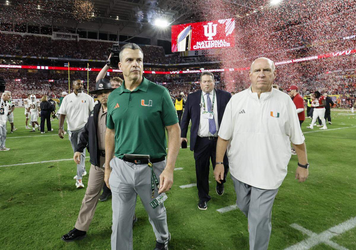 Miami Hurricanes head coach Mario Cristobal walks off the field after the Indiana Hoosiers defeat the Canes in the College Football Playoff National Championship Game at Hard Rock Stadium in Miami Gardens, Florida, on Monday, January 19, 2026.