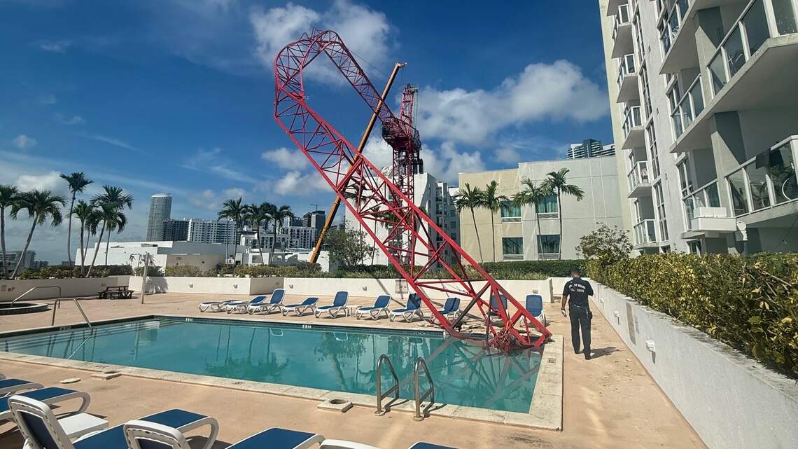 Construction crane collapses onto high-rise pool deck. No one injured
