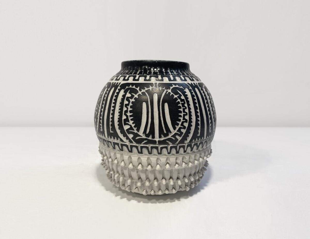 A piece of pottery by Ellie Schneiderman, who founded the South Florida Art Center on Lincoln Road in 1983, is on display and placed in the center of the gallery at Oolite Arts on Lincoln Road for its summer exhibition, ‘It Was Always About You . . .’