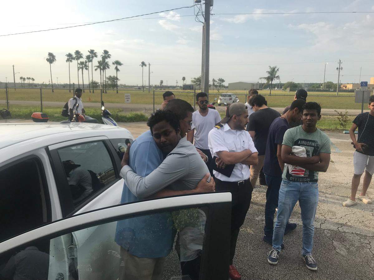 Robert Dean hugs a student before leaving the Dean International flight school on Monday, July 23, 2018. Dean announced that the school is closing down after two of its planes collided over the Everglades last week, killing four people.