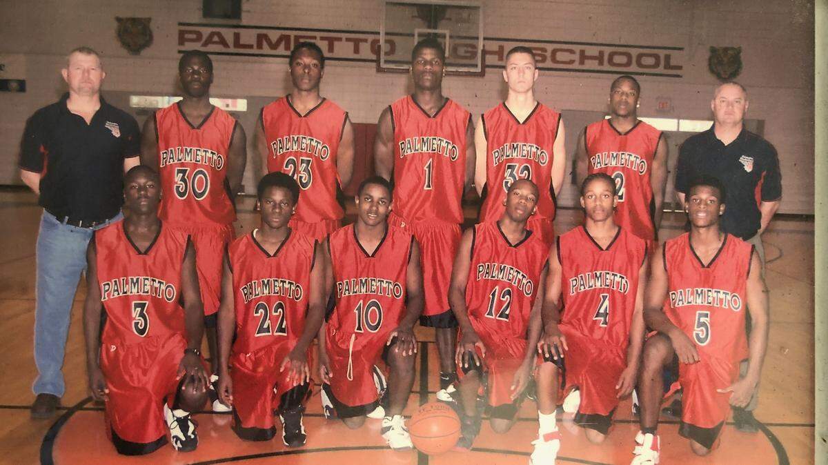 Palmetto High athletic director Kenny Ansbro, shown back right, has retired after 33 years at the school.