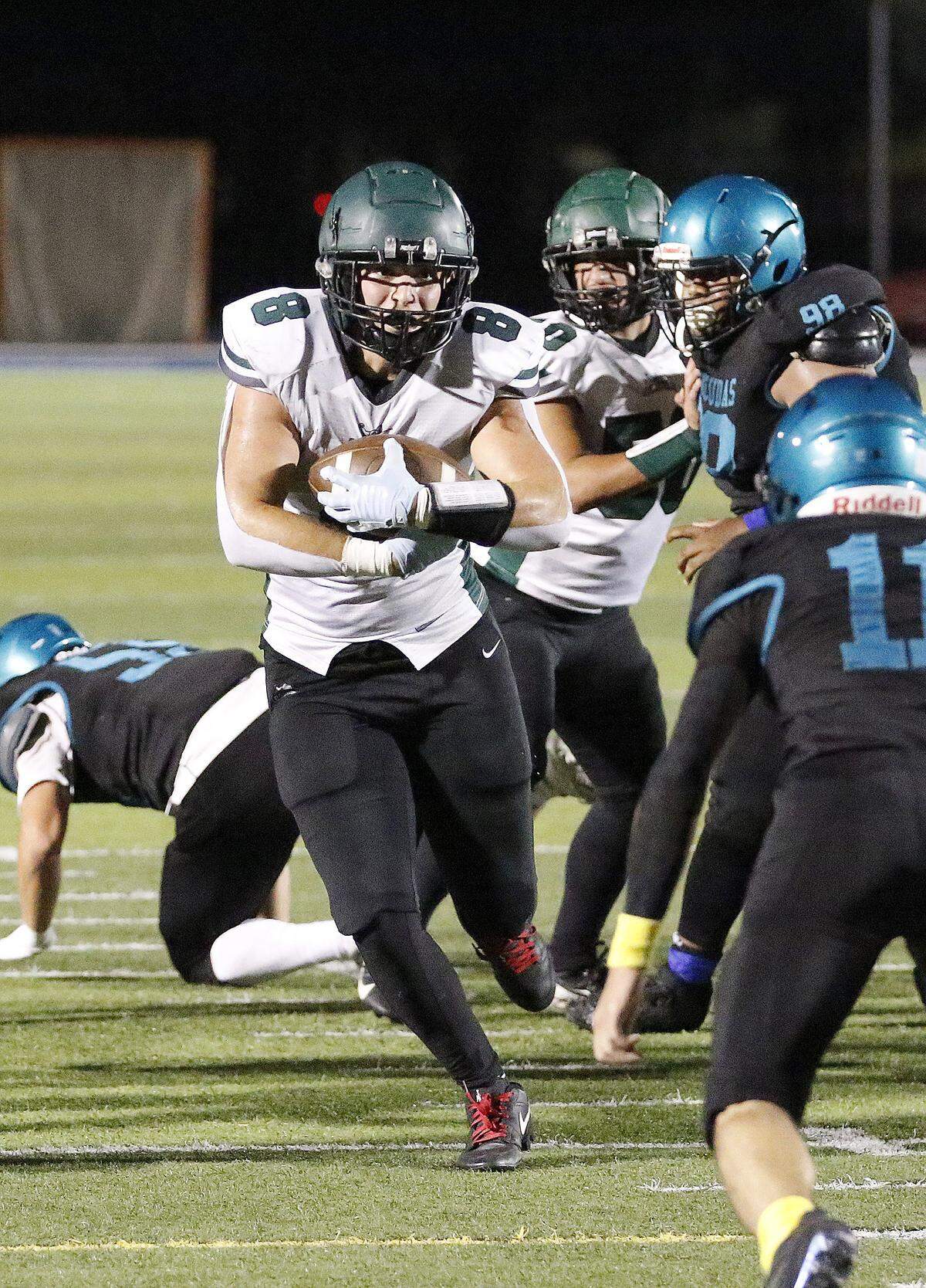 Hialeah Gardens Gladiators running back Dylan Santana (8) carries the ball against Coral Reef Barracudas during football game on Wednesday, November 12, 2025 at Tropical Part in Miami. Andrew Uloza / for Miami Herald