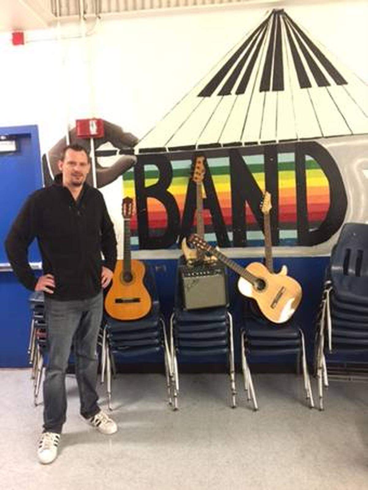 Music for Memories donated an electric bass guitar, two acoustic guitars, an electric guitar and a guitar amp to Georgia Jones-Ayers Middle School in Miami, as part of the organization’s mission to spread the opportunity for music education to local students. Patrick Converse, the middle school’s music teacher, is pictured with the instruments.