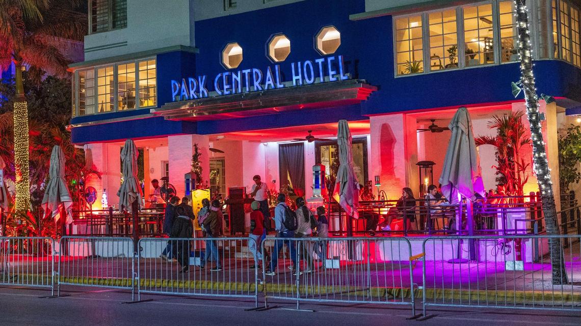 People make their way down Ocean Drive at night during spring break in Miami Beach, Florida, on Friday, March 21, 2025.