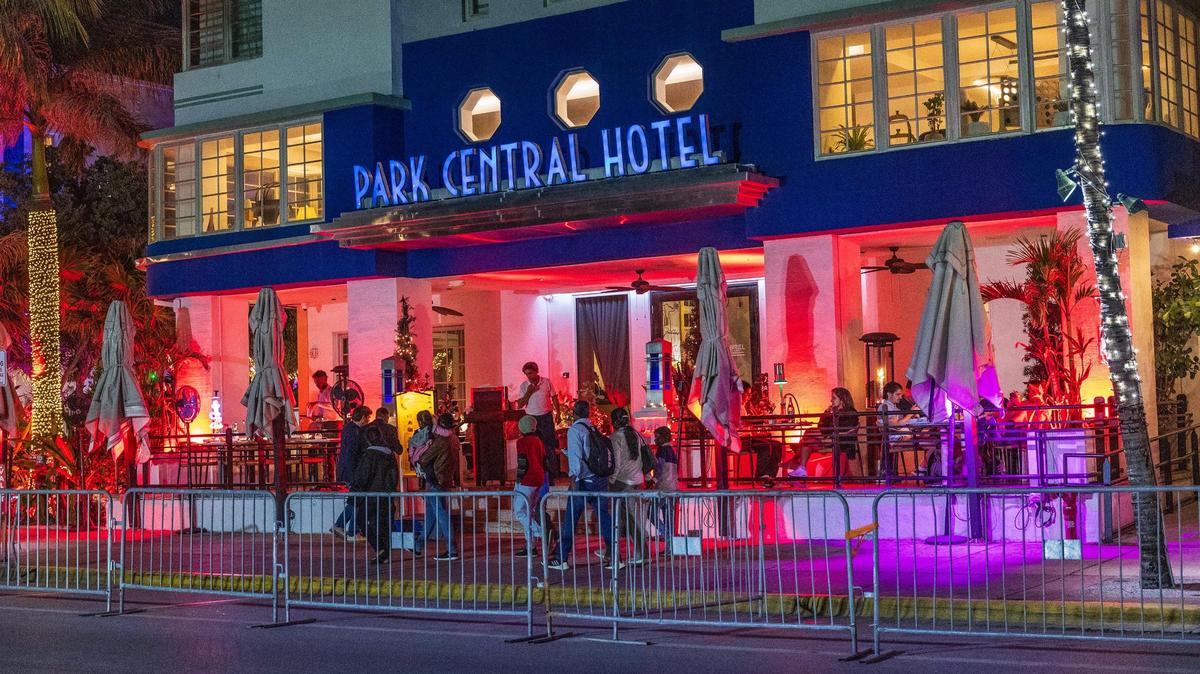 People make their way down Ocean Drive at night during spring break in Miami Beach, Florida, on Friday, March 21, 2025.