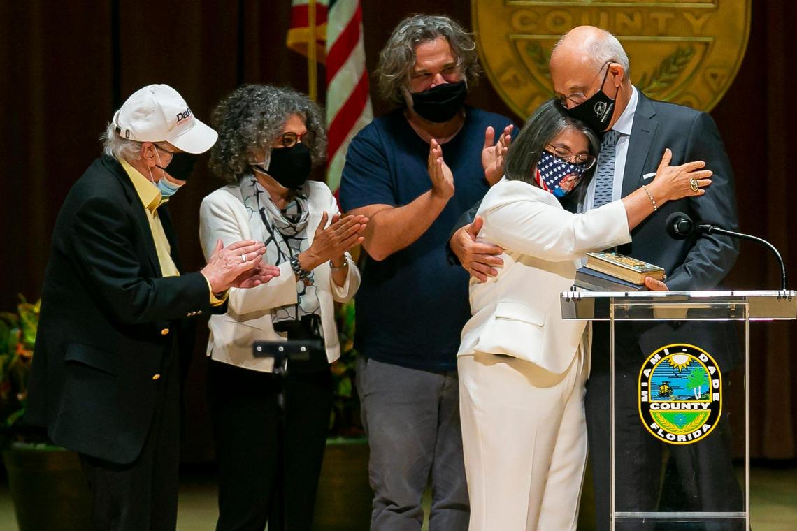 Newly elected Miami-Dade Mayor Daniella Levine Cava, center, is congratulated by her family after being sworn into office by Judge Roy K. Altman inside the Knight Concert Hall at the Adrienne Arsht Center for the Performing Arts in downtown Miami on Tuesday, November 17, 2020.