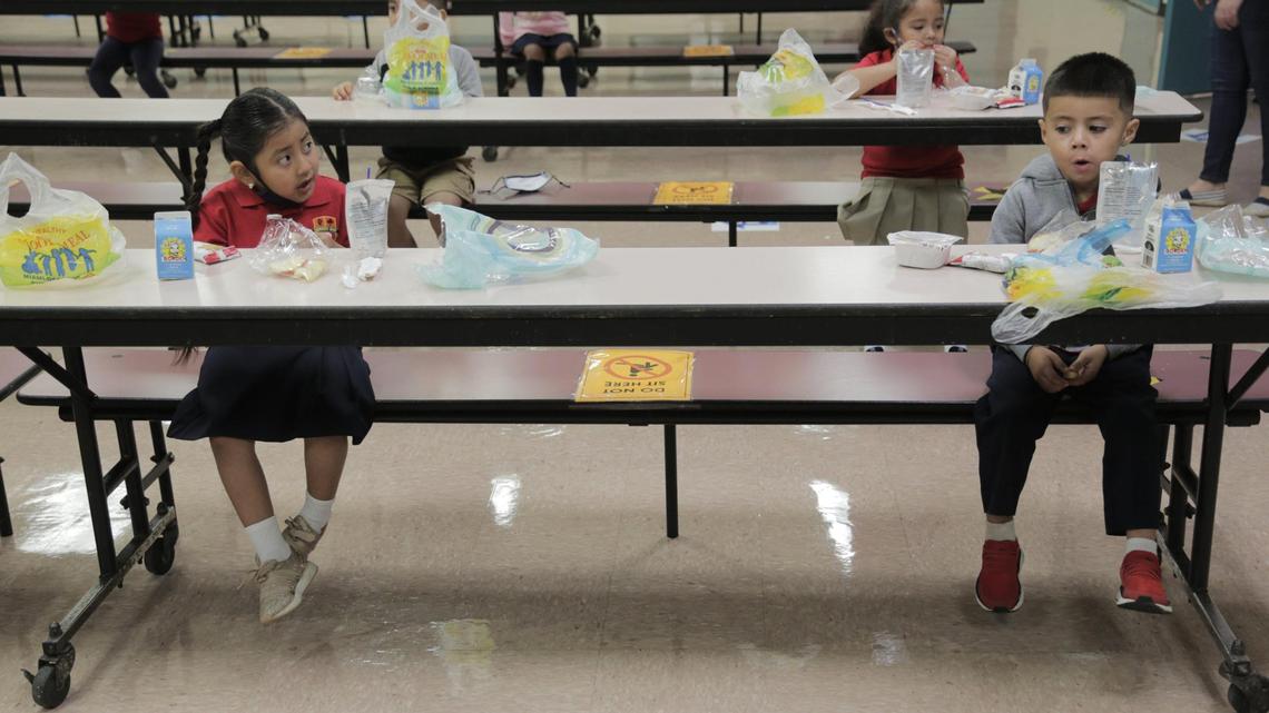 Homestead, Florida, October 5, 2020- Students enjoy breakfast in the cafeteria at Redland Elementary. Social distancing is maintained. It’s the first day of school re-openings in Miami-Dade. On Monday, only students in pre-k, kindergarten and first grade are welcomed back to schools.