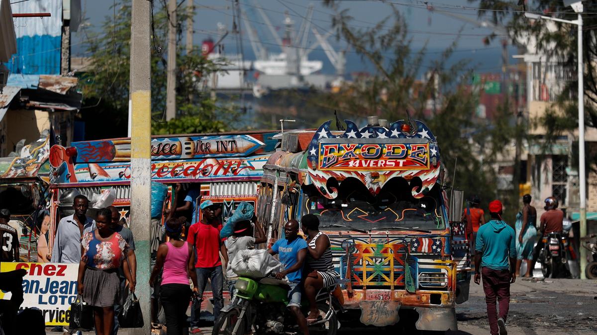 Residents go about their day during a break in anti-government protests, which had disrupted businesses and daily life in Port-au-Prince, Haiti, Saturday, Oct. 5, 2019.