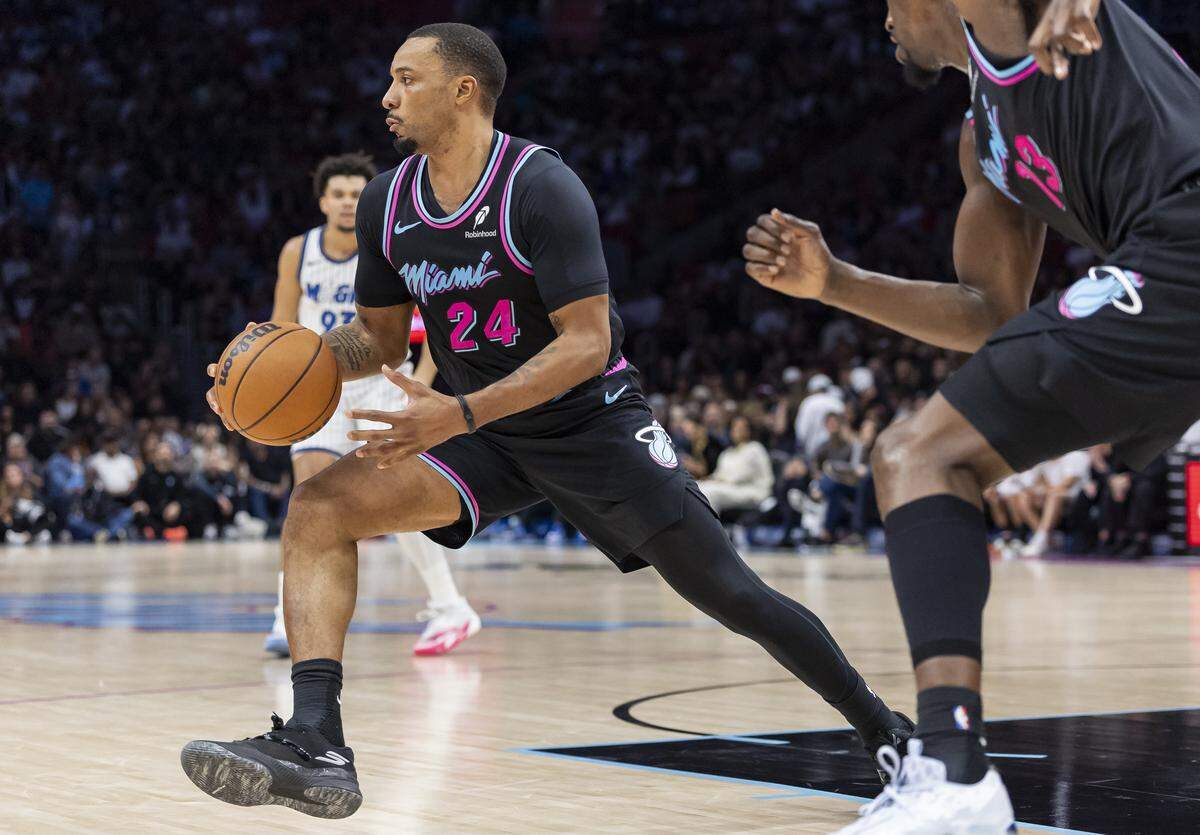 Miami Heat guard Norman Powell (24) drives the ball down the court against the Orlando Magic in the second half of their NBA game at Kaseya Center on March 14, 2026, in Miami.