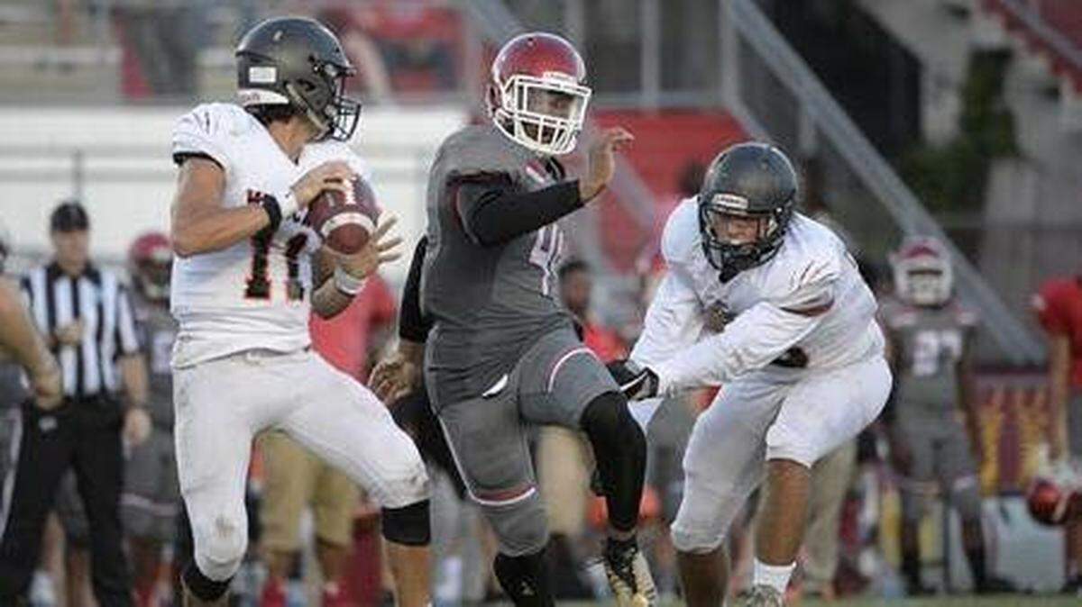Orlando Edgewater’s Nate White (No. 44) tries to make a tackle.