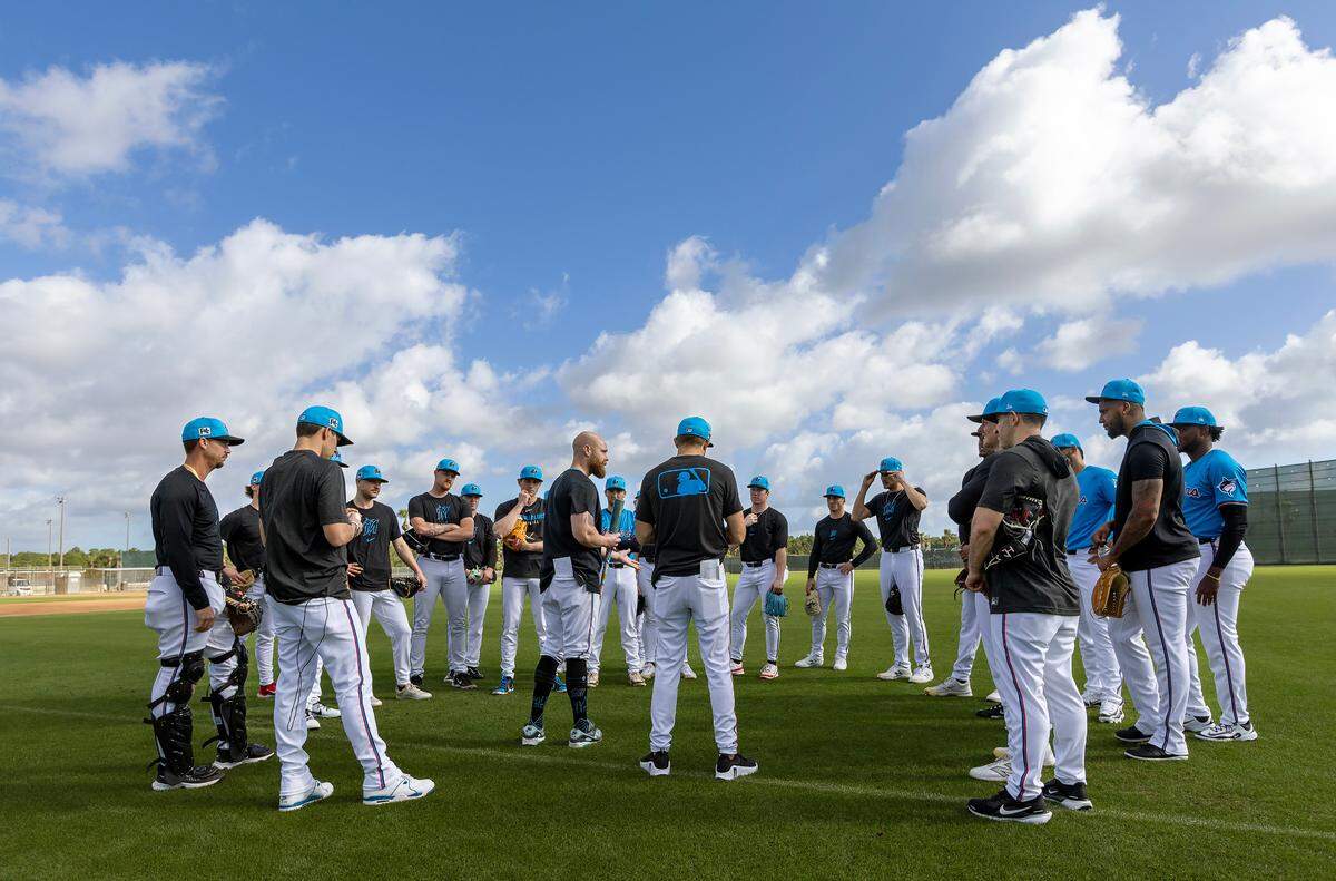 Miami Marlins bench coach Carson Vitale (25) talks with the players during spring training workouts for pitchers and catchers at Roger Dean Stadium in Jupiter, FL, on Wednesday, Feb. 12, 2025.