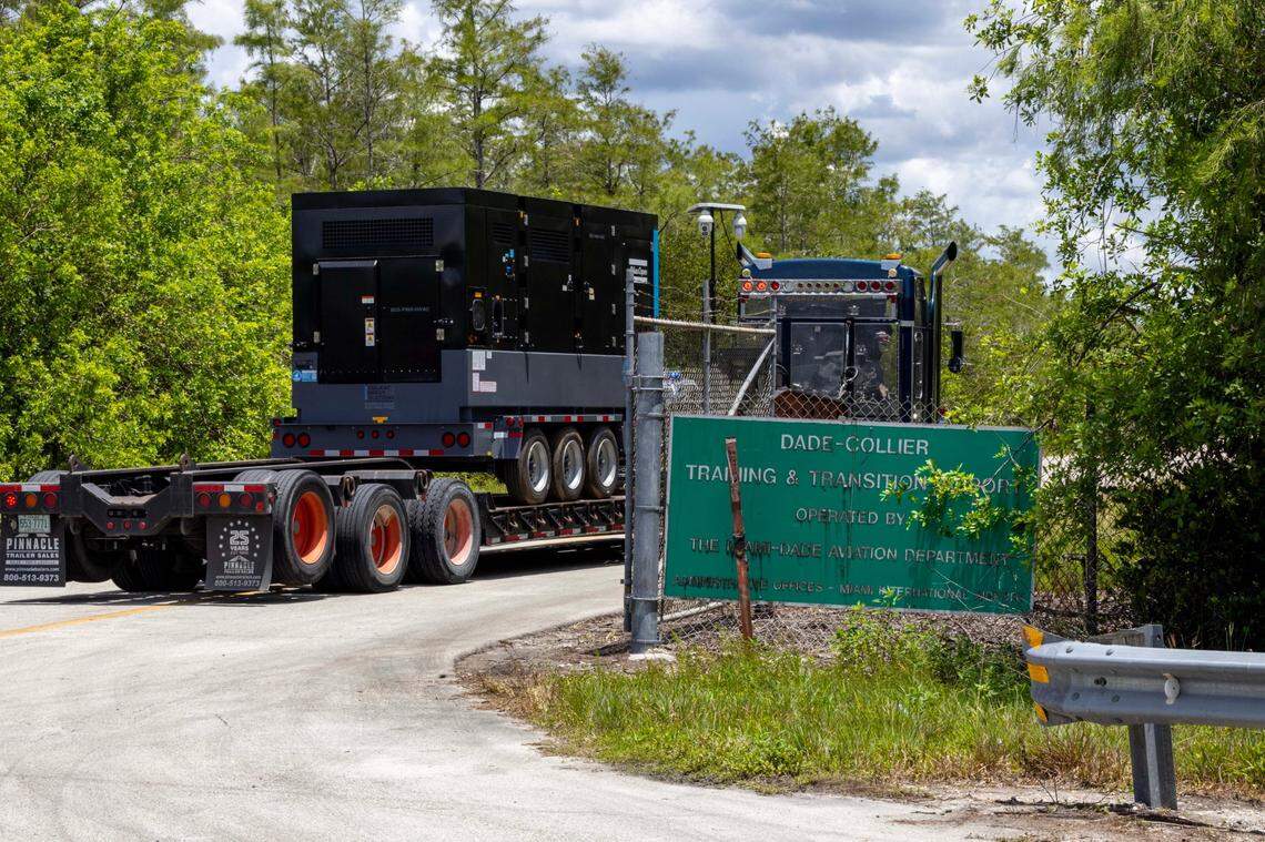 A truck transports heavy generators into Dade Collier Training and Transition Airport off Tamiami Trail on Monday, June 24, 2025, in Ochopee, Fla.