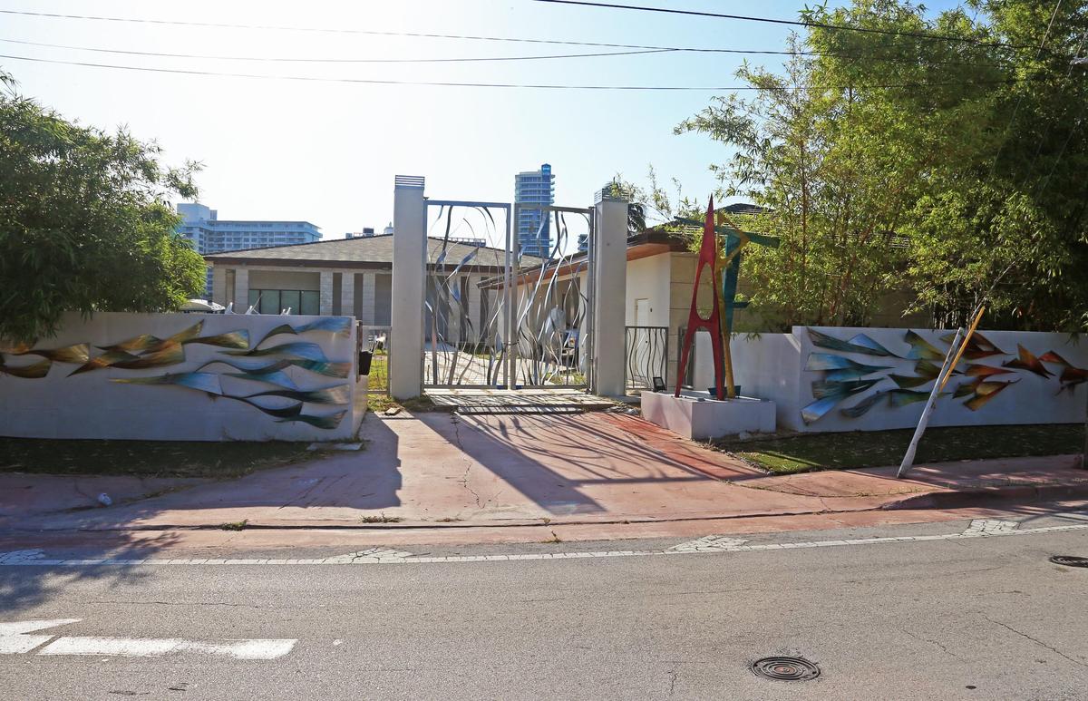 Artwork decorating the outside wall of a house at 5101 Pine Tree Drive in Miami Beach. The city removed the artwork on June 25 after the owners refused to do so despite code citations.