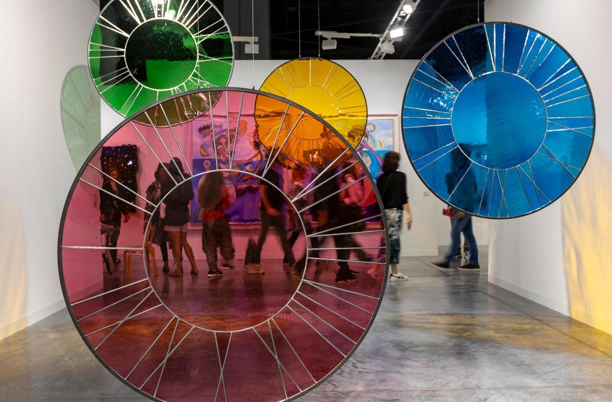 Miami Beach, Florida, December 6, 2023 - Artist Ugo Rondinone’s Pink Clock, Light Blue Clock, Light Orange Clock and Light Green Clock on display during Art Basel VIP day at the Miami Beach Convention Center