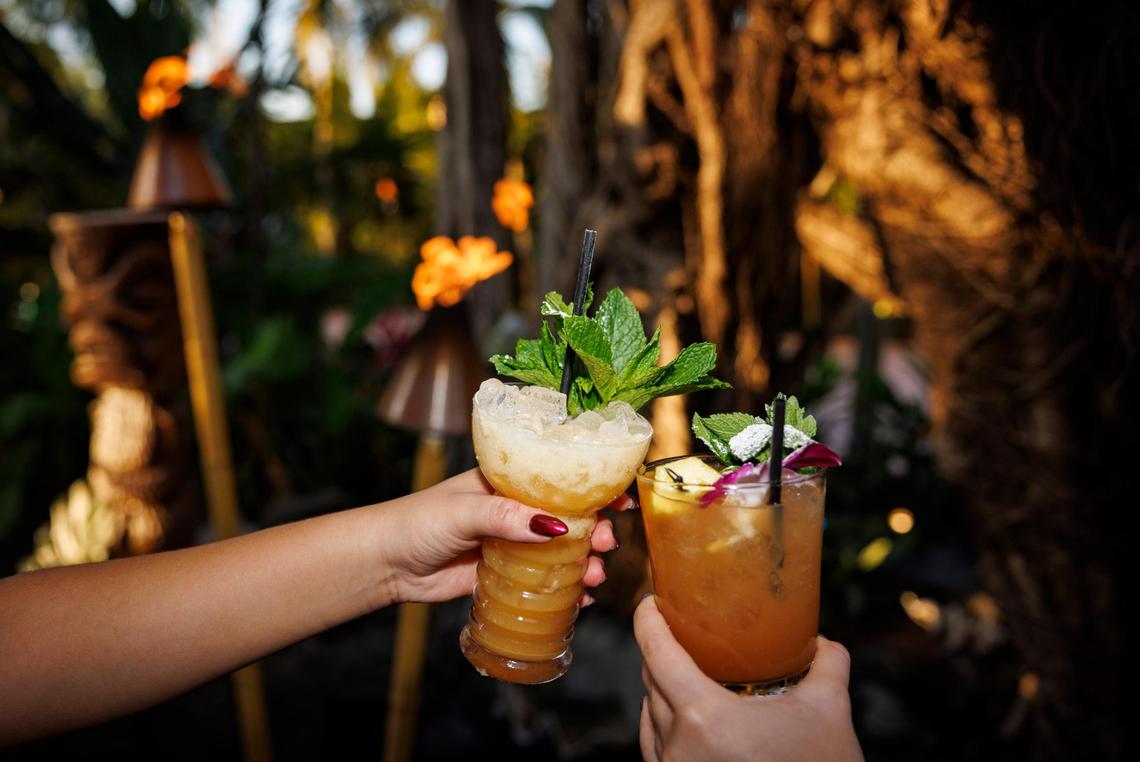 Cheers! Revelers enjoy the Deep Sea Diver drink, left, and the Mai-Tai, both signature cocktails at Mai-Kai.