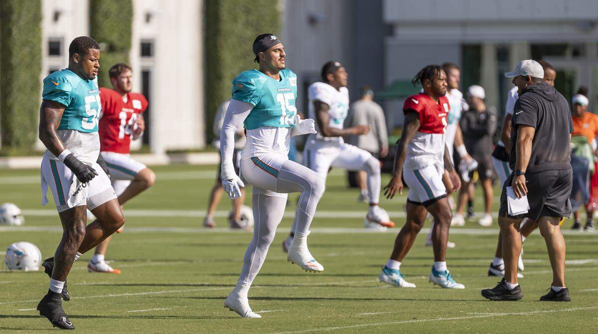 Miami Dolphins linebacker Jaelan Phillips (15) runs drills during training camp at the Baptist Health Training Complex on Tuesday, July 29, 2025, in Miami Gardens, Fla.