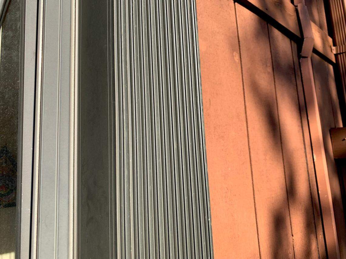 Accordion-style hurricane shutters can quickly be drawn across windows to protect against tropical storms and hurricanes.