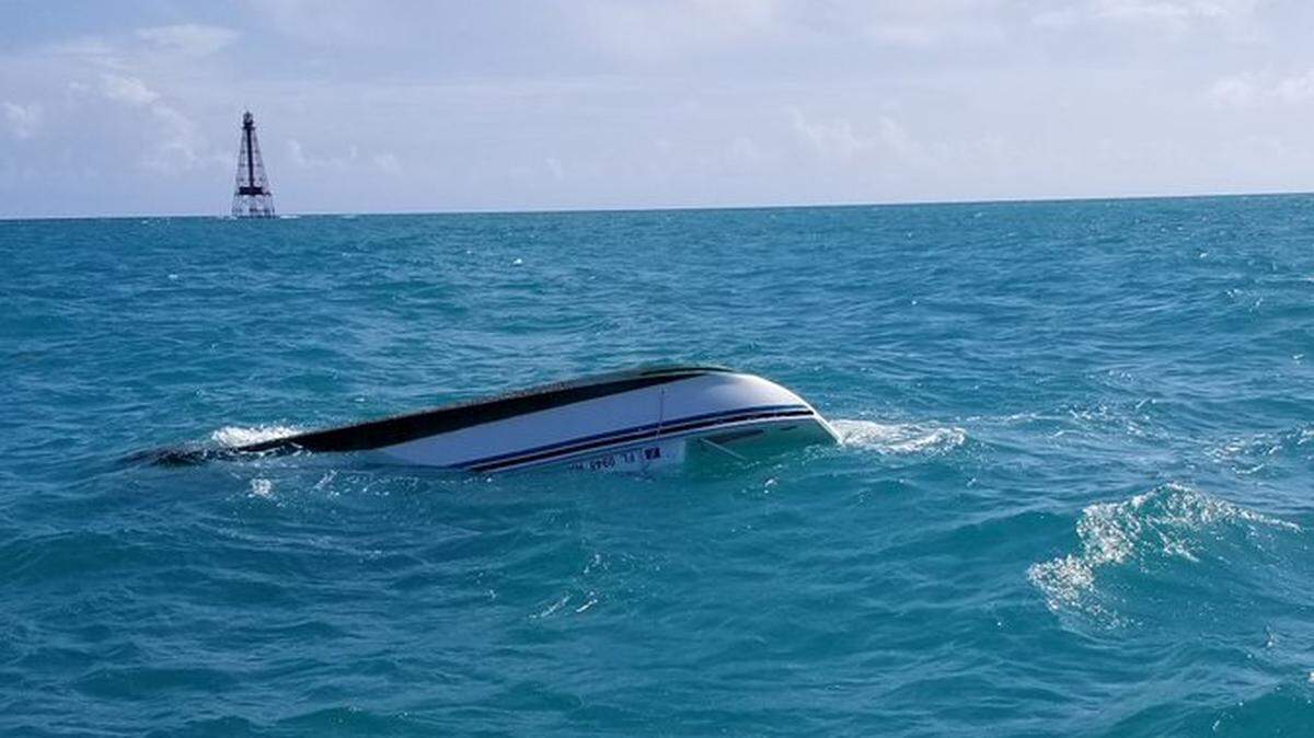 The capsized catamaran that had one adult and three children Saturday evening