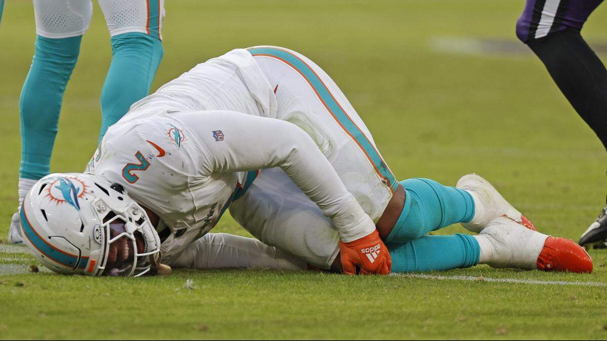 Miami Dolphins linebacker Bradley Chubb grabs his knee after an injury during the game against the Baltimore Ravens in the fourth quarter at M&T Bank Stadium in Baltimore, Maryland on Sunday, December 31, 2023.