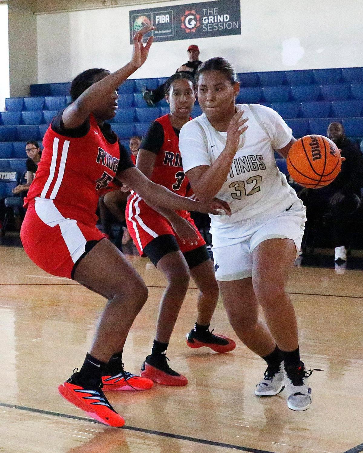 Miami High’s Nicole Penalver (32) slides around a Southridge player during the GMAC girls’ championship basketball game Saturday, January 25, 2025 at Miami Senior HS in Miami.