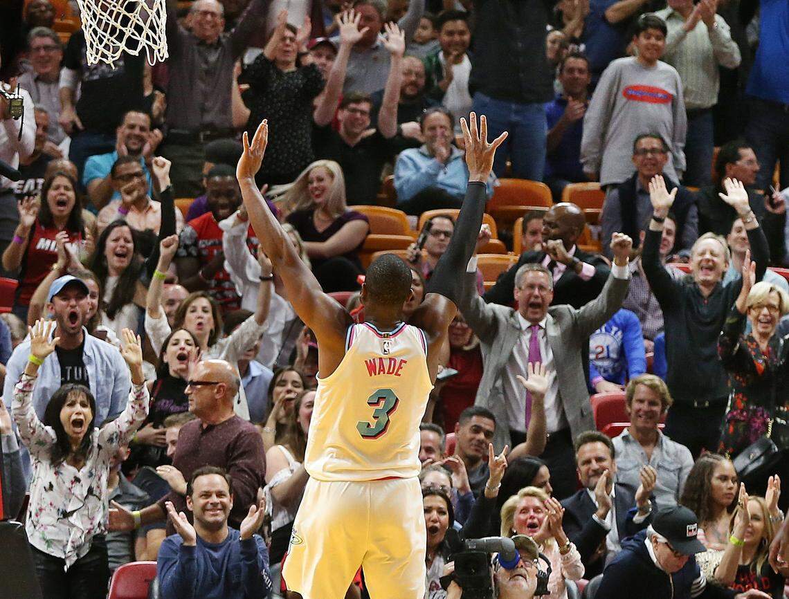 Heat guard Dwyane Wade reacts after he dunks against Philadelphia in the fourth quarter of the game between the Miami Heat and the Philadelphia 76ers at AmericanAirlines Arena in Miami on Thursday, March 8, 2018.