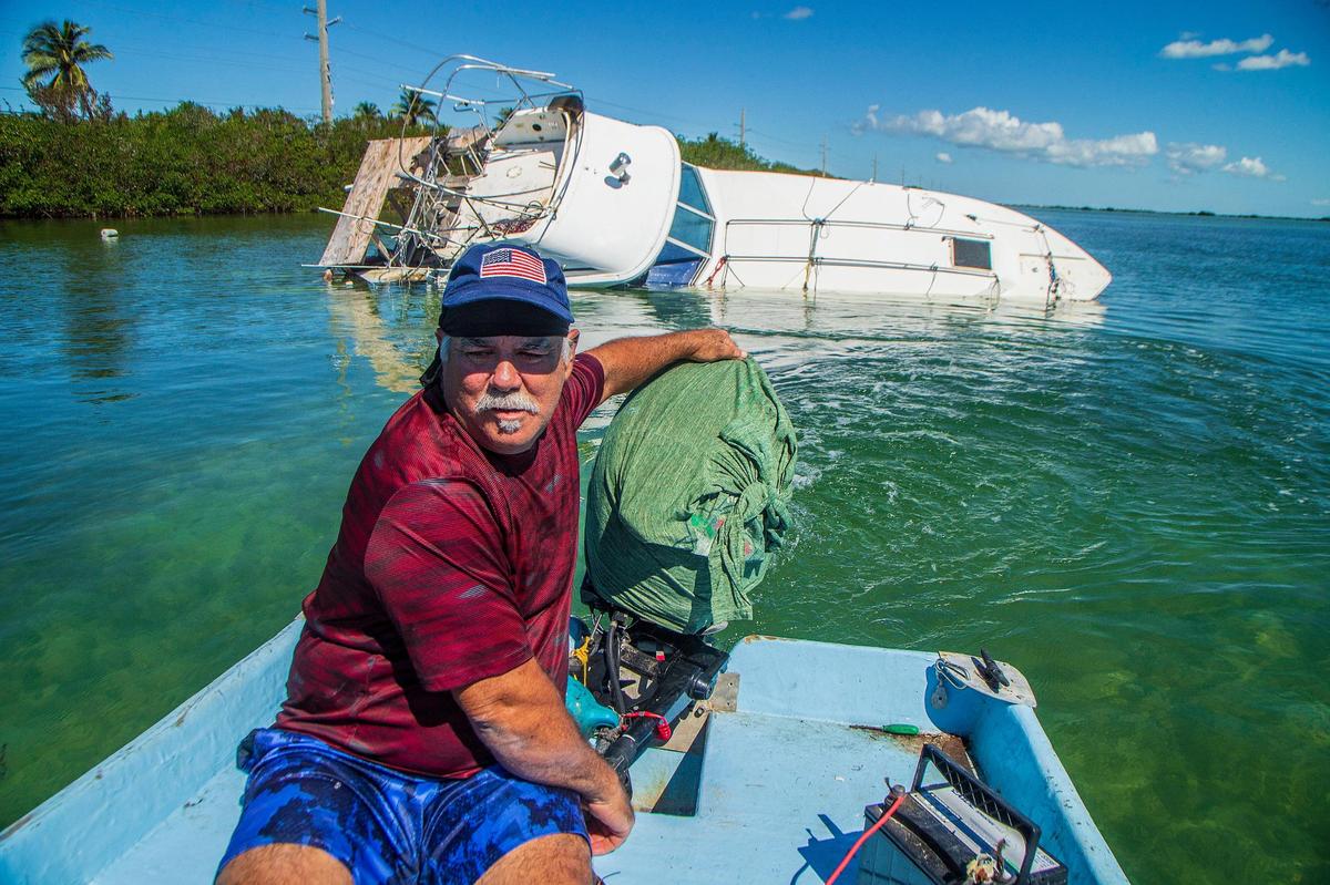 Fisherman Ernesto Hernandez navigates around his sunken boat off Sugarloaf Key Thursday, Oct. 27, 2022. His vessel sank in Hurricane Ian, which passed by the Florida Keys on Tuesday, Sept. 27, 2022, before hitting the Southwest coast the next day as a Category 4 storm.