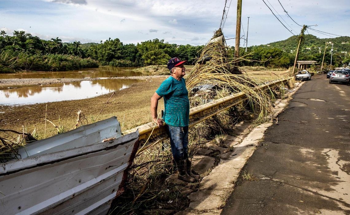 On Tuesday, Sept. 20, 2022, Antonio Perez Miranda looks to his house damaged by the mud left when the river “Rio de la Plata” overflowed in the San Jose de Toa Baja neighborhood.