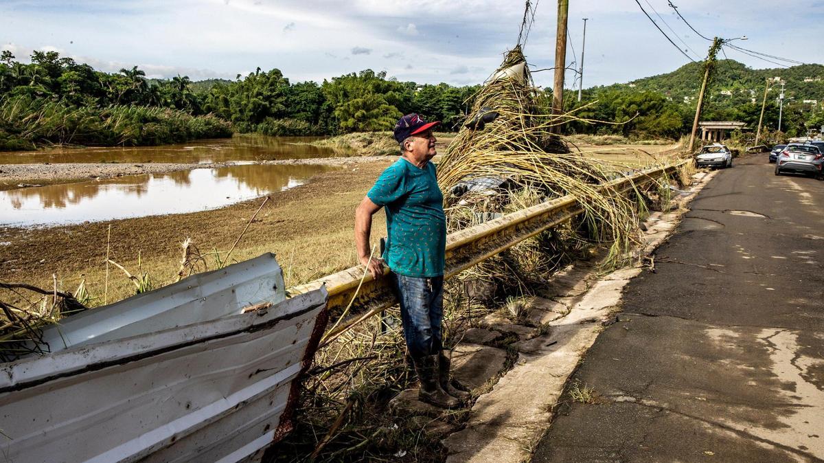 Antonio Perez Miranda looks Tuesday to his house damaged by the mud left by the river “Rio de la Plata” overflowing in San Jose de Toa Baja after Hurricane Fiona hit Puerto Rico on Sunday, Sept. 18, 2022.