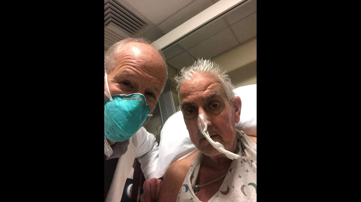 Dr. Bartley P. Griffith with patient David Bennett, Sr. Griffith placed the genetically modified pig heart into Bennett on Jan. 7 at the University of Maryland Medical Center.