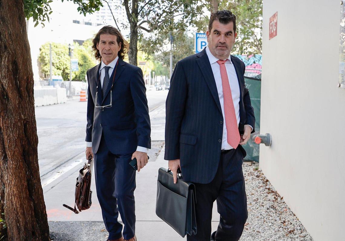 Howard Srebnick and Joel Denaro, left to right, attorneys for twin brothers Alon and Oren Alexander walk out of the James Lawrence King Federal Justice Building after hearing in Miami, Florida, on Friday, December 20, 2024.