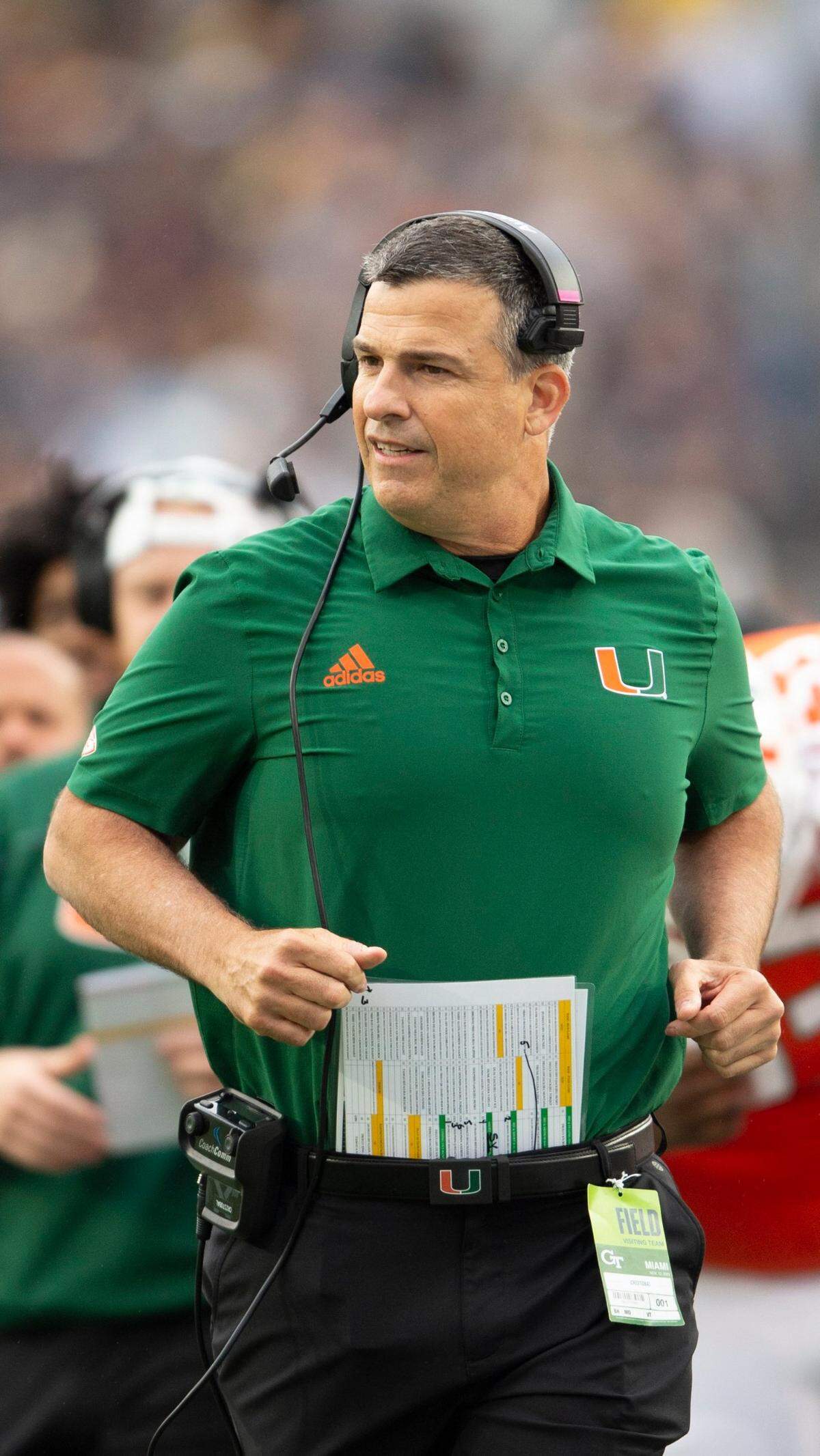 Miami head coach Mario Cristobal runs onto the field in the first half of an NCAA college football game against Georgia Tech, Saturday, Nov. 12, 2022, in Atlanta. (AP Photo/Hakim Wright Sr.)