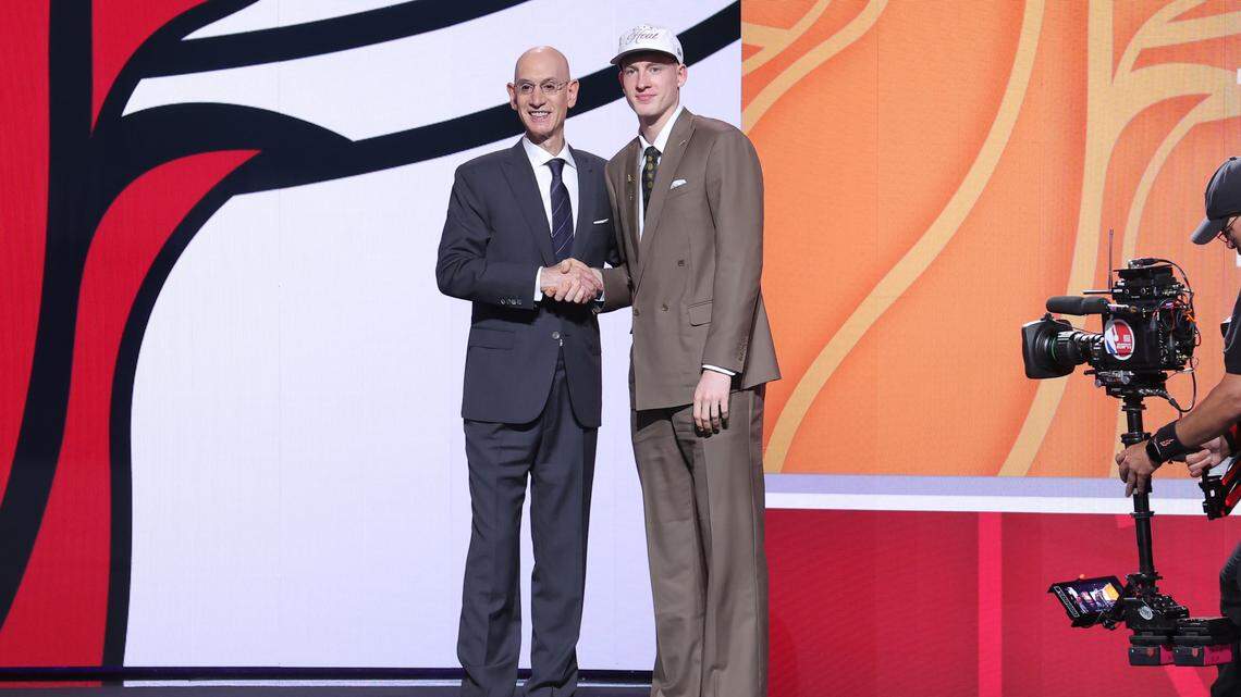 Kasparas Jakucionis stands with NBA commissioner Adam Silver after being selected as the 20th pick by the Miami Heat in the first round of the 2025 NBA Draft at Barclays Center.