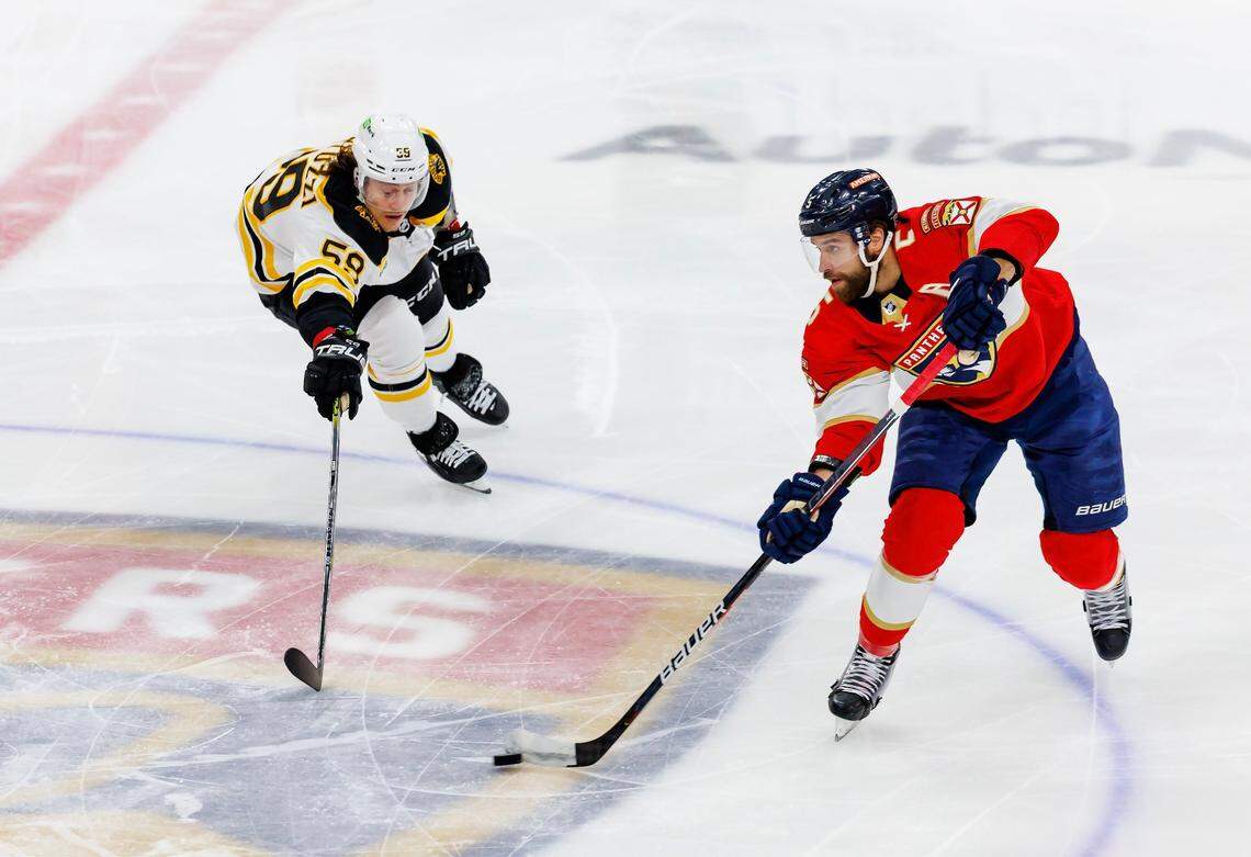 Florida Panthers defenseman Aaron Ekblad (5) carries the puck against Boston Bruins left wing Tyler Bertuzzi (59) during the first period of Game 3 of a first round NHL Stanley Cup series at FLA Live Arena on Friday, April 21, 2023 in Sunrise, Fl.