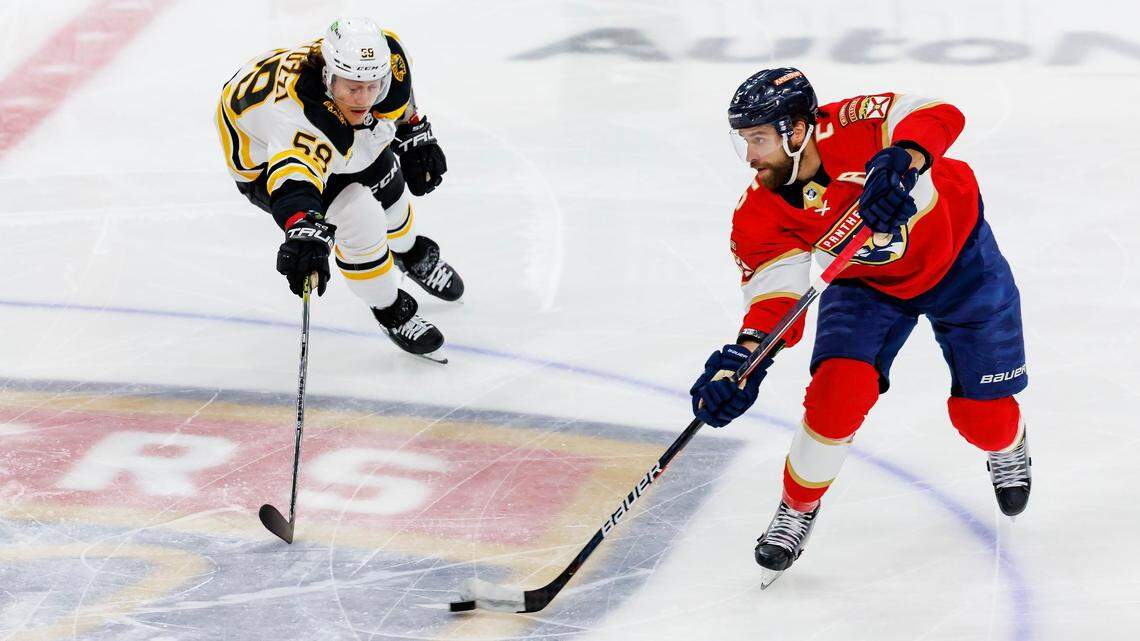 Florida Panthers defenseman Aaron Ekblad (5) carries the puck against Boston Bruins left wing Tyler Bertuzzi (59) during the first period of Game 3 of a first round NHL Stanley Cup series at FLA Live Arena on Friday, April 21, 2023 in Sunrise, Fl.