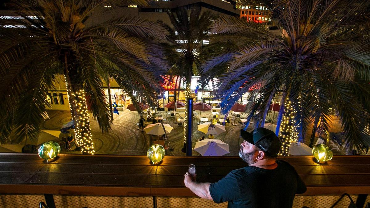 Jorgie Ramos looks out over Giralda Plaza in Coral Gables from his restaurant Cebada Rooftop, which is reopening after being closed for months.