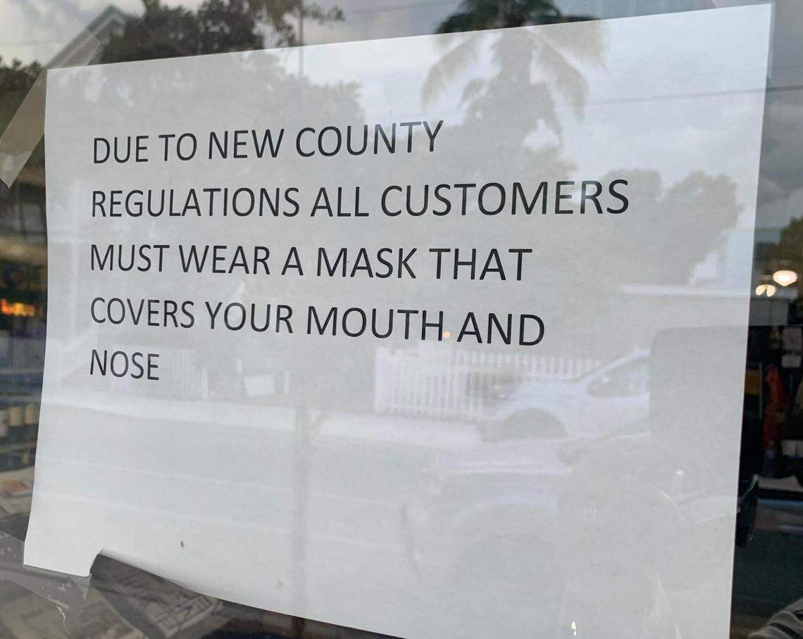 A Key West grocery store warns its customers after the Monroe County Commission created a new mandatory mask ordinance on June 17, 2020.