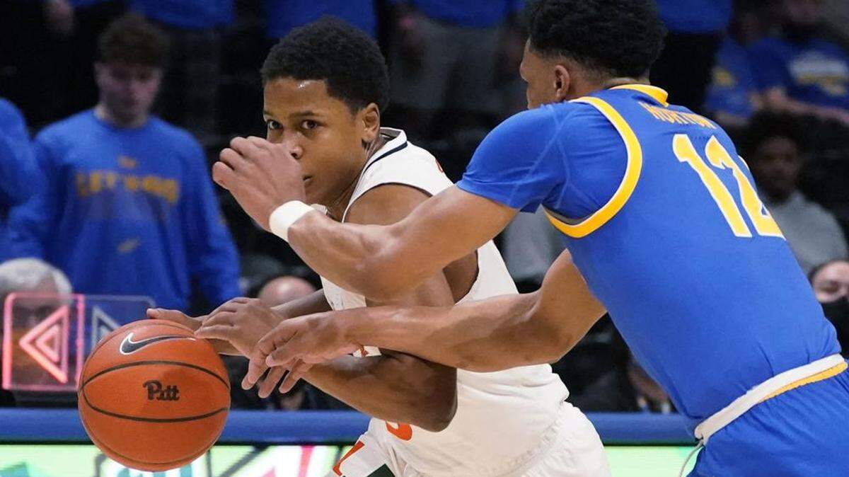 Charlie Moore (with ball) scored 19 points to help lead the University of Miami to an 85-64 road win against Pitt on Feb. 22, 2022.