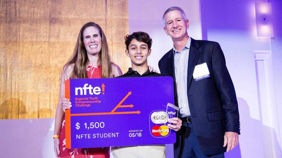 Richard Smithies of Coral Gables High School placed first in the South Florida Network for Teaching Entrepreneurship’s Regional Youth Entrepreneurship Challenge for his business called Helios Mining. He is pictured, center, with Senior Director Jeannine Schloss, left, and Advisory Board Member Richard Jackson.