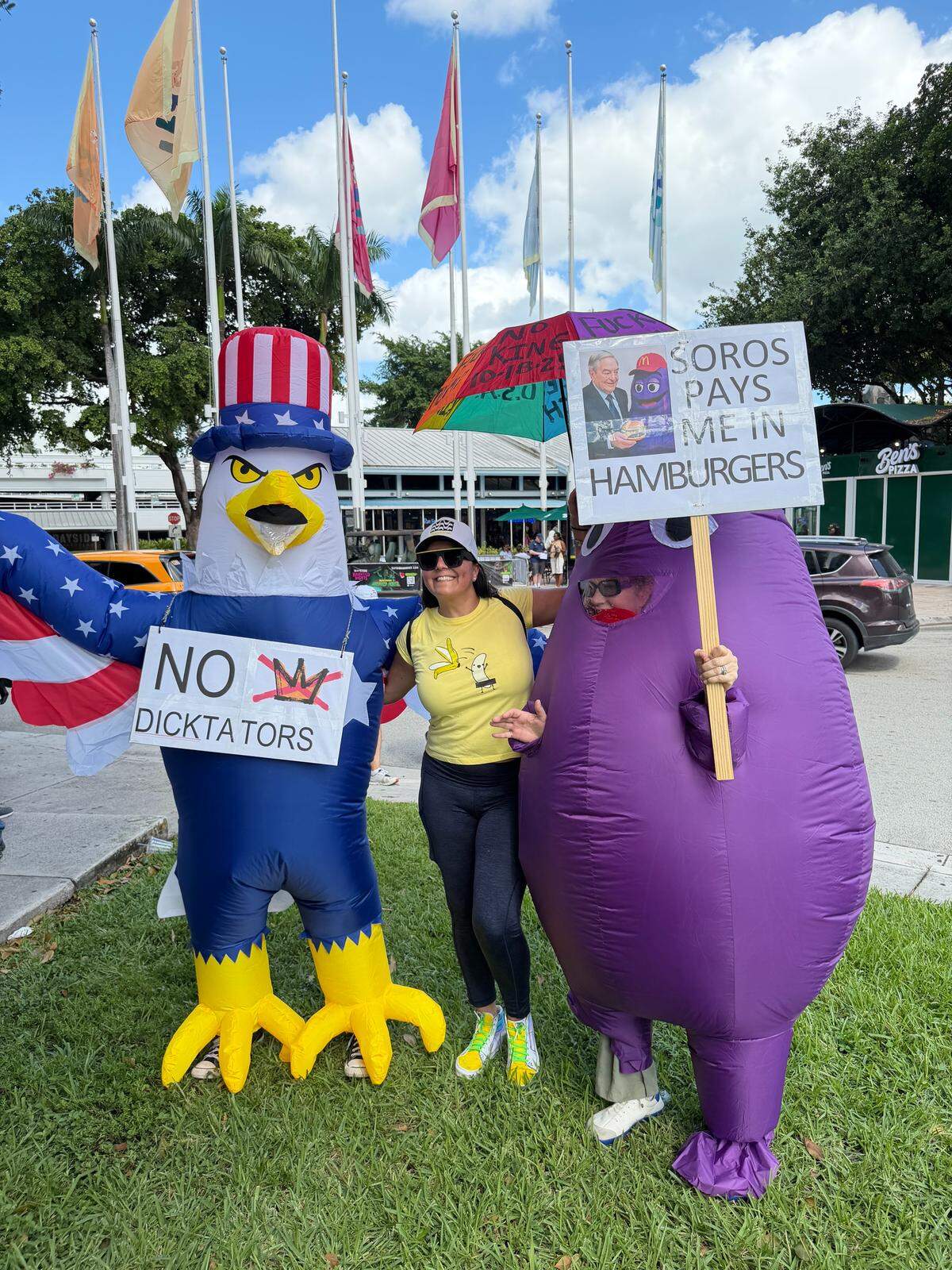 Protesters at Miami’s “No Kings” rally wearing inflatable costumes.