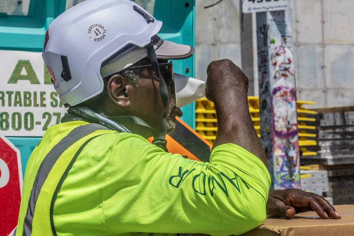 Construction worker Patrick Khon hydrates while working on Wynwood as a heat advisory is in effect for most of South Florida, on Wednesday, July 08, 2026.