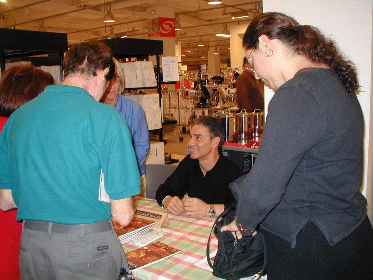 Steven Perricone, owner of Perricone’s Marketplace & Cafe, signs copies of his new cookbook after a cooking demonstration at The Cellar at the Dadeland Macy’s store.