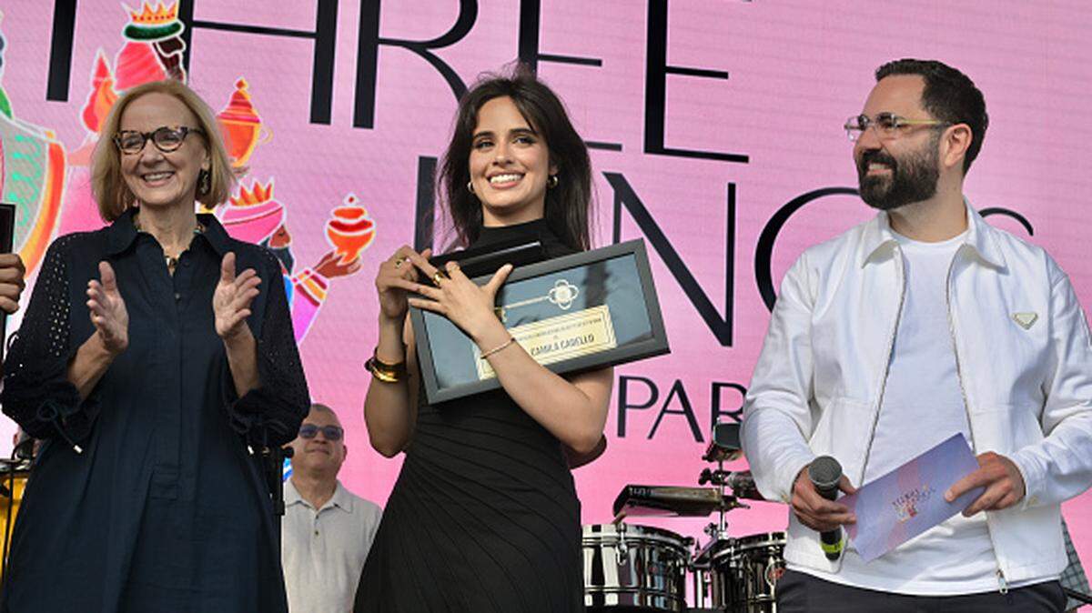MIAMI, FLORIDA - JANUARY 11:  Eileen Higgins, Camila Cabello and Enrique Santos attend the 2026 Three Kings Parade on January 11, 2026 in Miami, Florida. (Photo by Manny Hernandez/Getty Images)